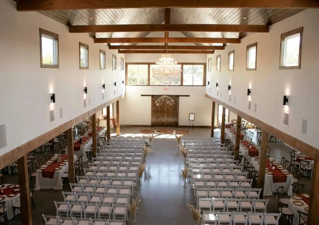 Indoor wedding ceremony space with natural light and chandeliers in North Texas